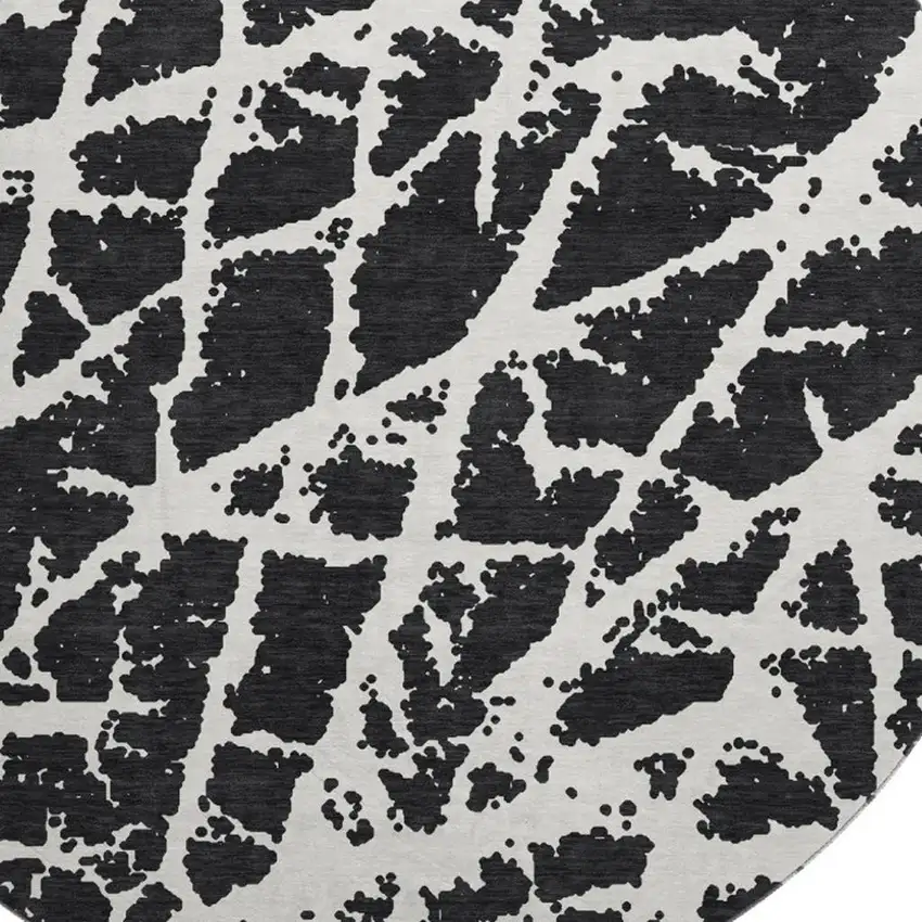 8' Black And Ivory Abstract Washable Round Rug With UV Protection Photo 3