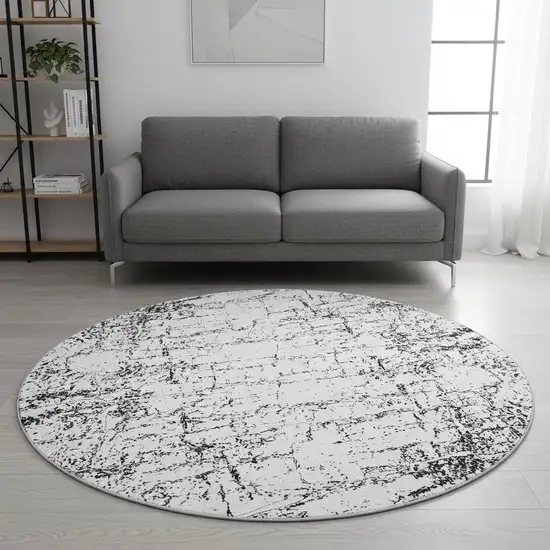 8' Black And Ivory Abstract Washable Round Rug With UV Protection Photo 2