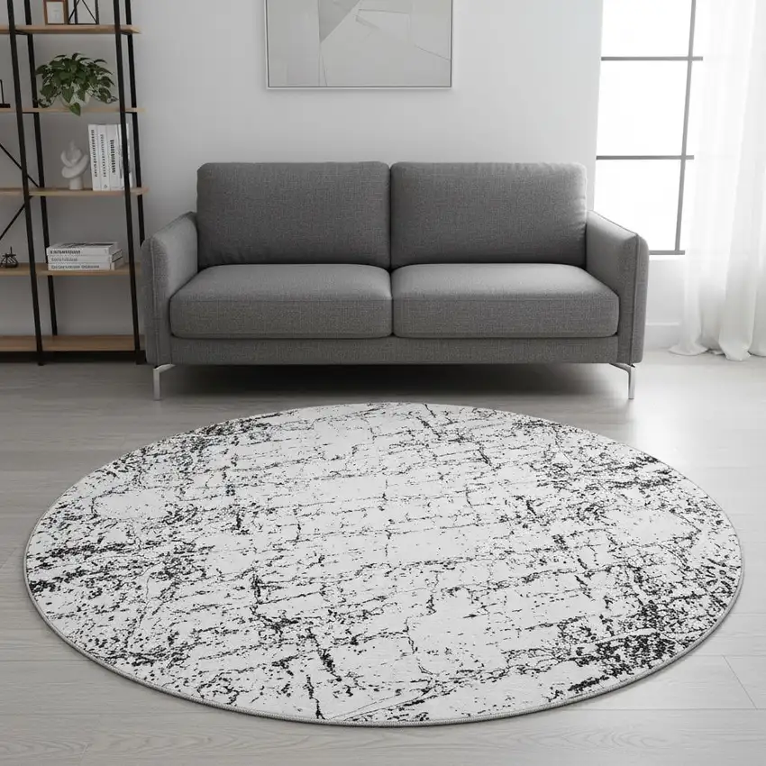 8' Black And Ivory Abstract Washable Round Rug With UV Protection Photo 2
