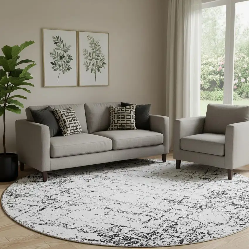 8' Black And Ivory Abstract Washable Round Rug With UV Protection Photo 1