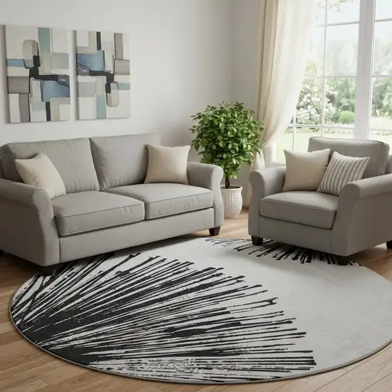 8' Black And Ivory Abstract Washable Round Rug With UV Protection Photo 1