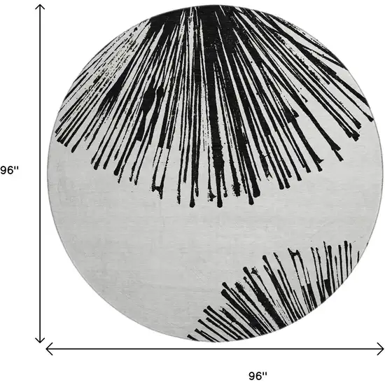 8' Black And Ivory Abstract Washable Round Rug With UV Protection Photo 3