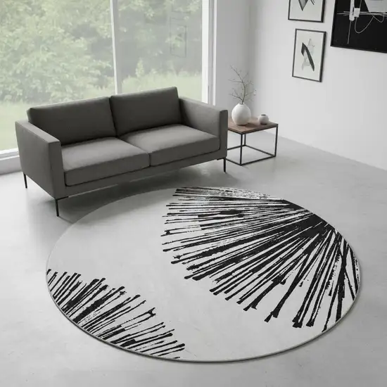 8' Black And Ivory Abstract Washable Round Rug With UV Protection Photo 2
