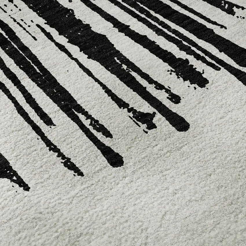 8' Black And Ivory Abstract Washable Round Rug With UV Protection Photo 9