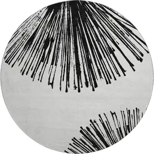Photo of 8' Black And Ivory Abstract Washable Round Rug With UV Protection