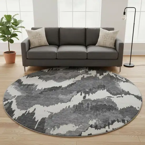 8' Black And Ivory Abstract Washable Round Rug With UV Protection Photo 1