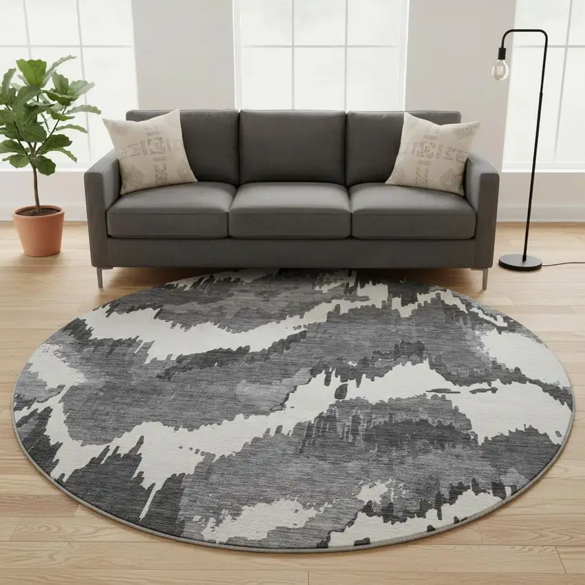 8' Black And Ivory Abstract Washable Round Rug With UV Protection Photo 1