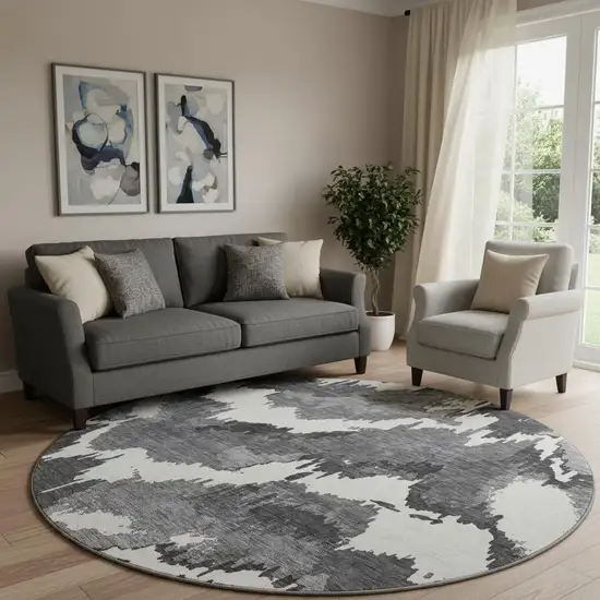 8' Black And Ivory Abstract Washable Round Rug With UV Protection Photo 1