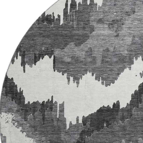 8' Black And Ivory Abstract Washable Round Rug With UV Protection Photo 4