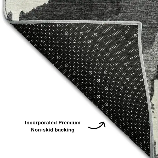 8' Black And Ivory Abstract Washable Round Rug With UV Protection Photo 7