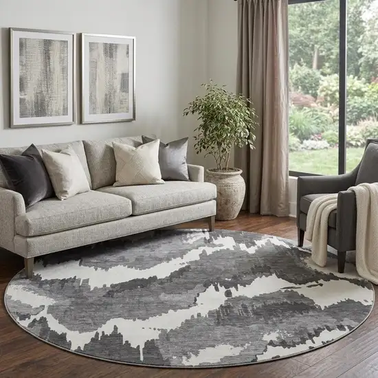8' Black And Ivory Abstract Washable Round Rug With UV Protection Photo 1