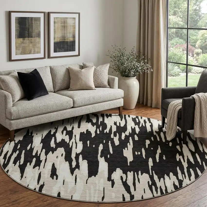 8' Black And Ivory Abstract Washable Round Rug With UV Protection Photo 1