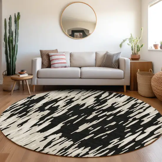 8' Black And Ivory Abstract Washable Round Rug With UV Protection Photo 2