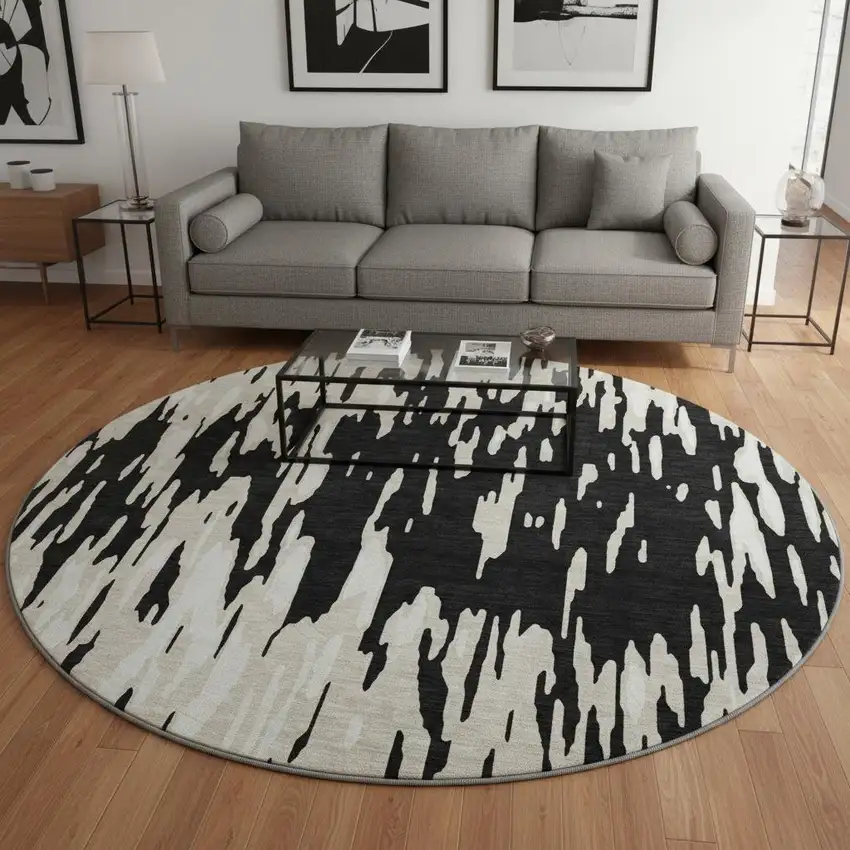 8' Black And Ivory Abstract Washable Round Rug With UV Protection Photo 2