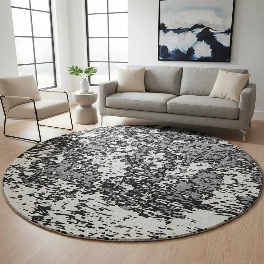 8' Black And Ivory Abstract Washable Round Rug With UV Protection Photo 2
