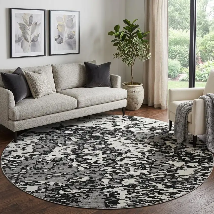 8' Black And Ivory Abstract Washable Round Rug With UV Protection Photo 1