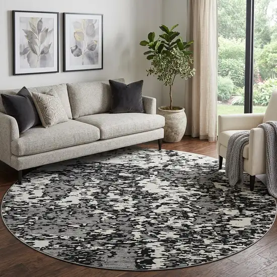 8' Black And Ivory Abstract Washable Round Rug With UV Protection Photo 1