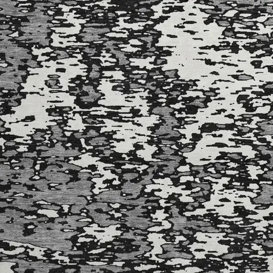 8' Black And Ivory Abstract Washable Round Rug With UV Protection Photo 2