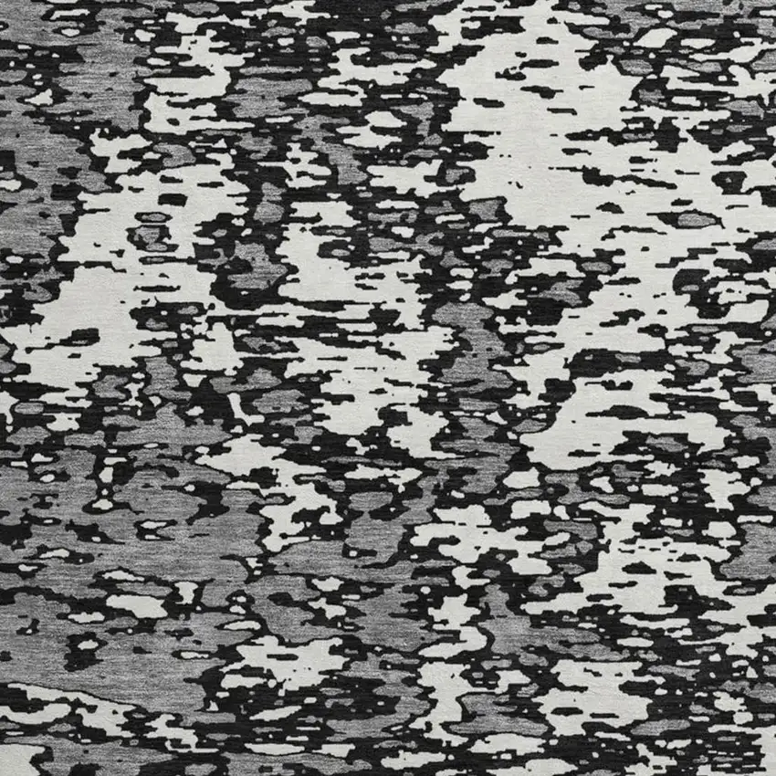 8' Black And Ivory Abstract Washable Round Rug With UV Protection Photo 2