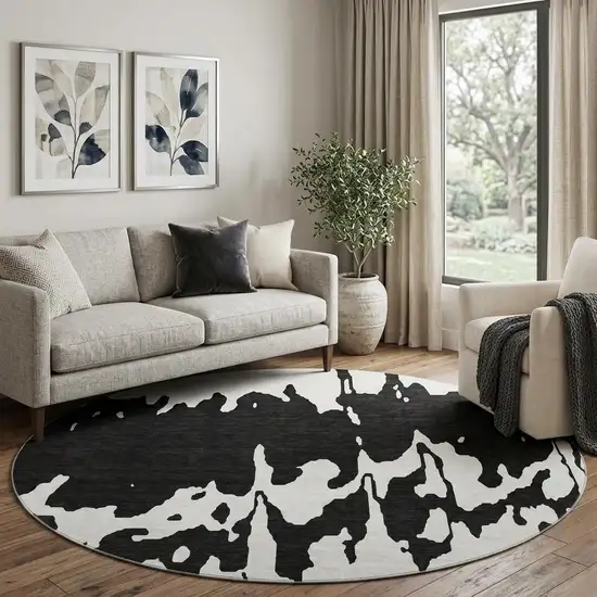 8' Black And Ivory Abstract Washable Round Rug With UV Protection Photo 1