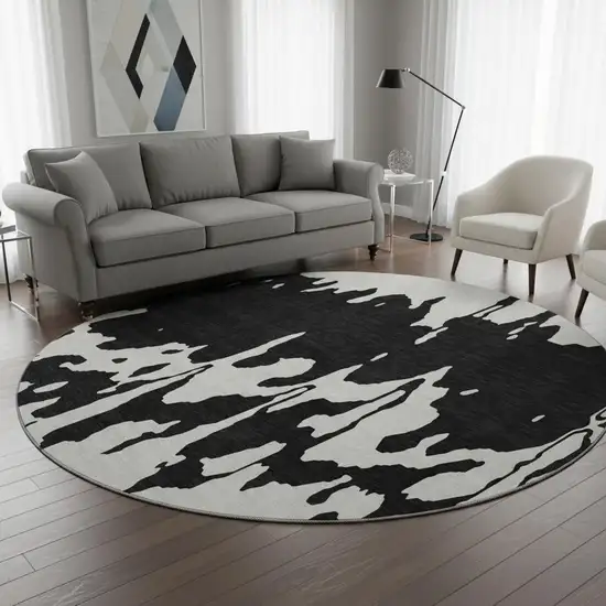 8' Black And Ivory Abstract Washable Round Rug With UV Protection Photo 2