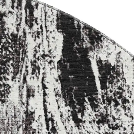 8' Black And Ivory Abstract Washable Round Rug With UV Protection Photo 2