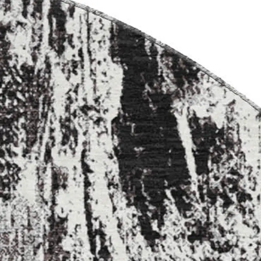 8' Black And Ivory Abstract Washable Round Rug With UV Protection Photo 2