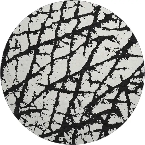 8' Black And Ivory Abstract Washable Round Rug With UV Protection Photo 1