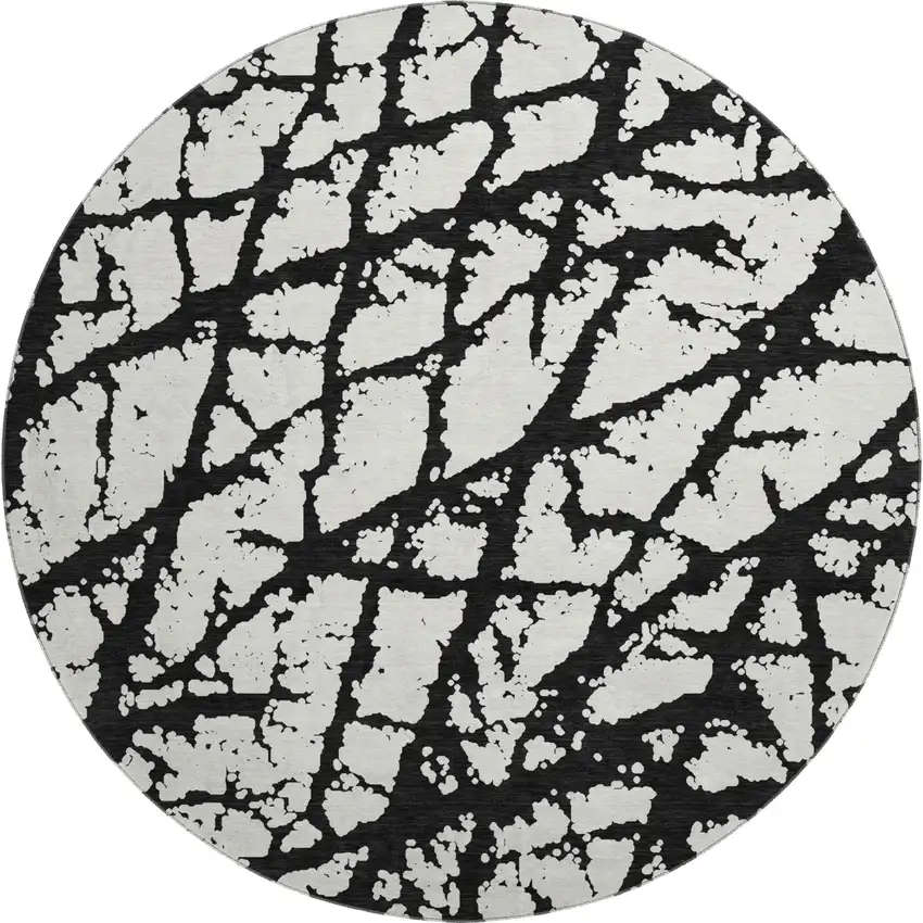 8' Black And Ivory Abstract Washable Round Rug With UV Protection Photo 1