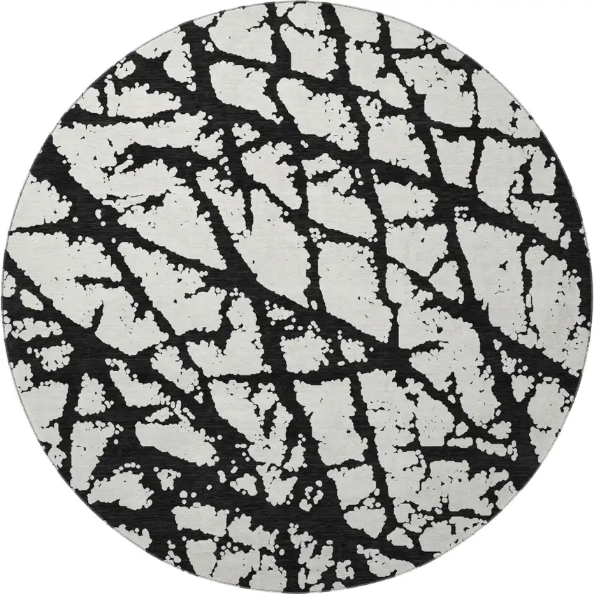 8' Black And Ivory Abstract Washable Round Rug With UV Protection Photo 3