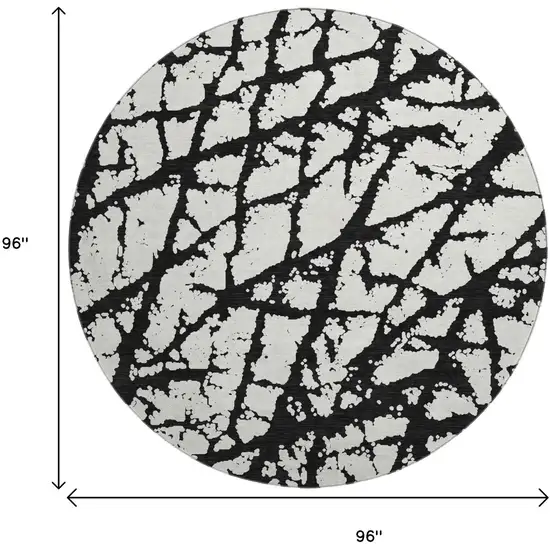 8' Black And Ivory Abstract Washable Round Rug With UV Protection Photo 9