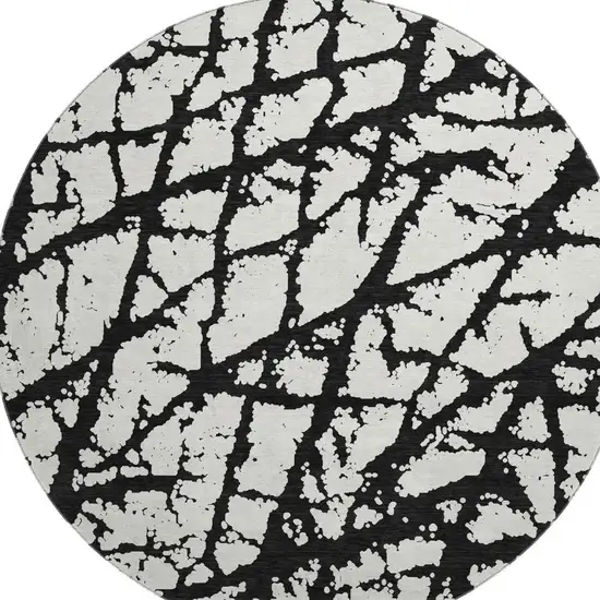 8' Black And Ivory Abstract Washable Round Rug With UV Protection Photo 2