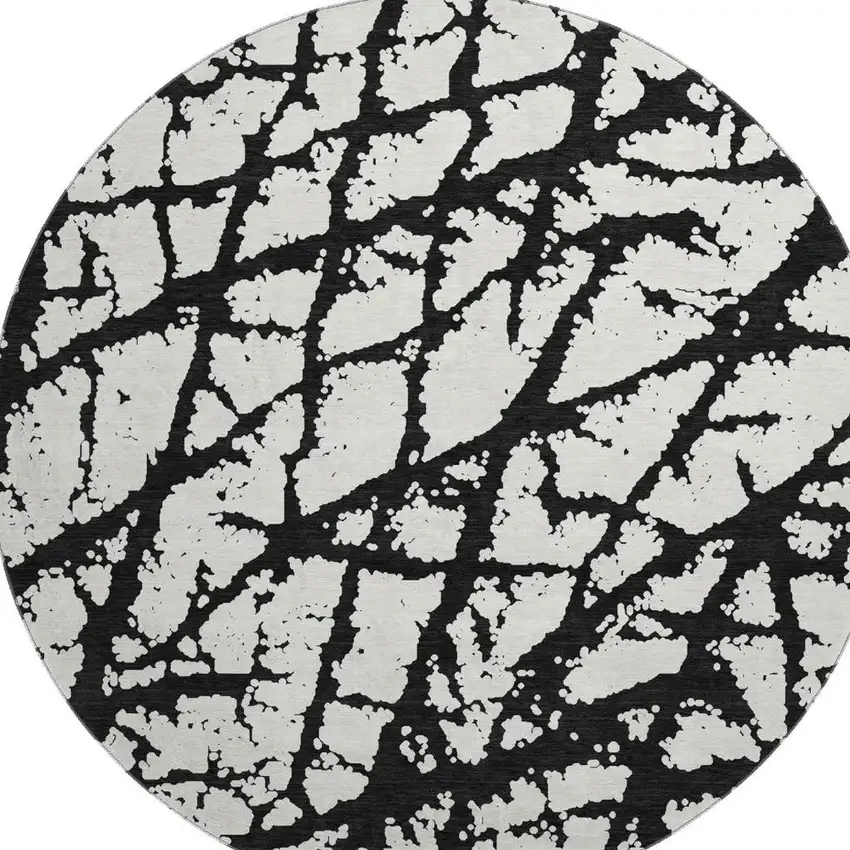 8' Black And Ivory Abstract Washable Round Rug With UV Protection Photo 2