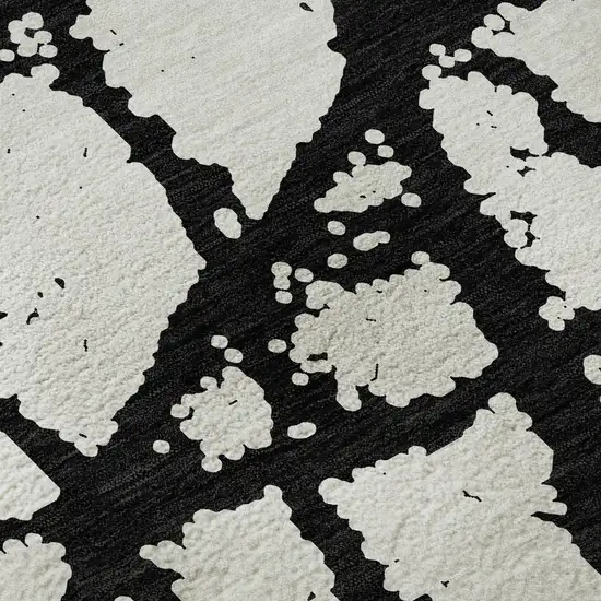 8' Black And Ivory Abstract Washable Round Rug With UV Protection Photo 8