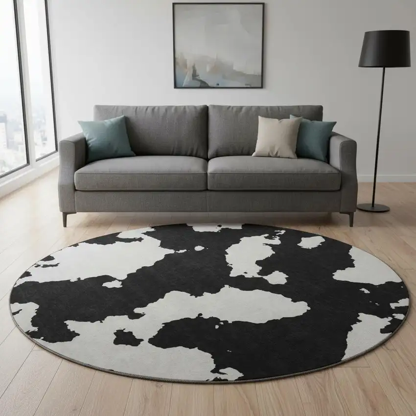 8' Black And Ivory Abstract Washable Round Rug With UV Protection Photo 2