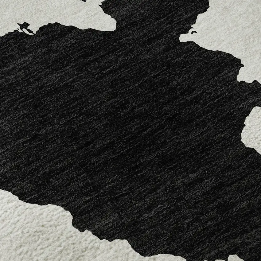 8' Black And Ivory Abstract Washable Round Rug With UV Protection Photo 8