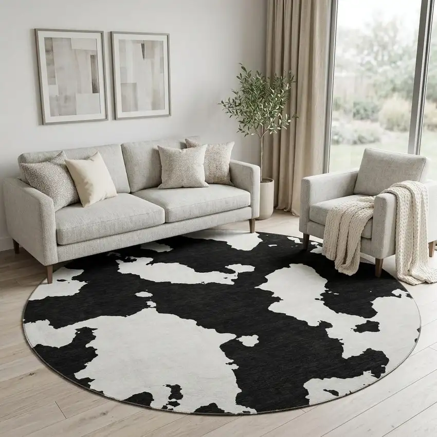 8' Black And Ivory Abstract Washable Round Rug With UV Protection Photo 1