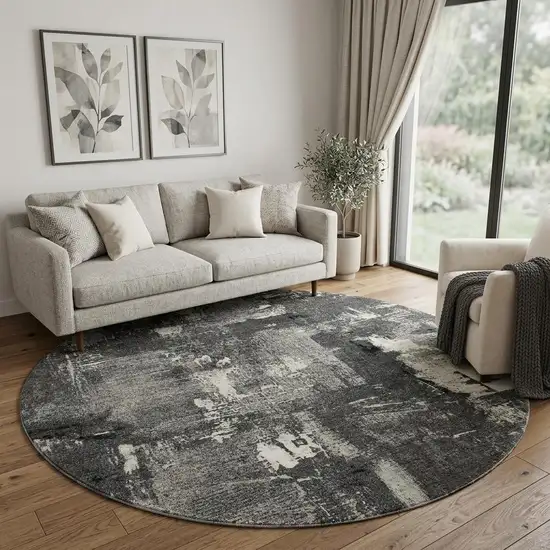 8' Black And Ivory Abstract Washable Round Rug With UV Protection Photo 1