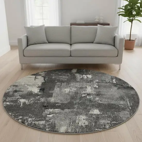 8' Black And Ivory Abstract Washable Round Rug With UV Protection Photo 2