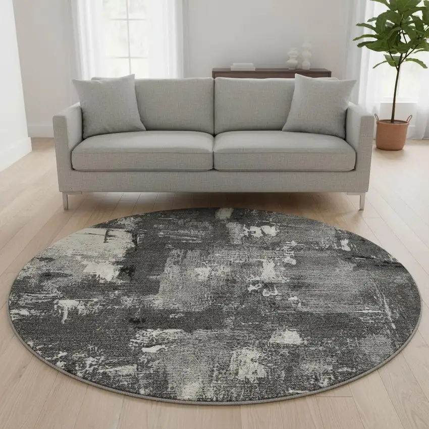 8' Black And Ivory Abstract Washable Round Rug With UV Protection Photo 2