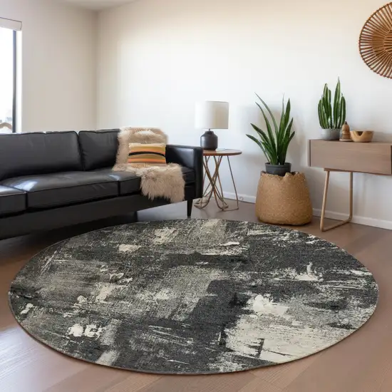 8' Black And Ivory Abstract Washable Round Rug With UV Protection Photo 4