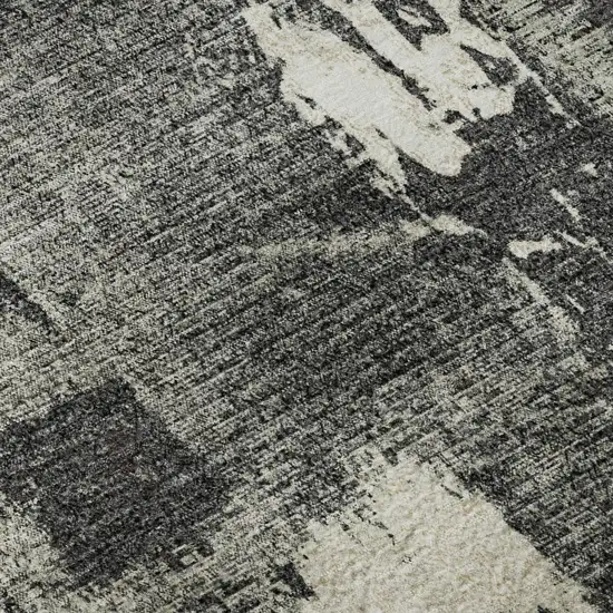 8' Black And Ivory Abstract Washable Round Rug With UV Protection Photo 8