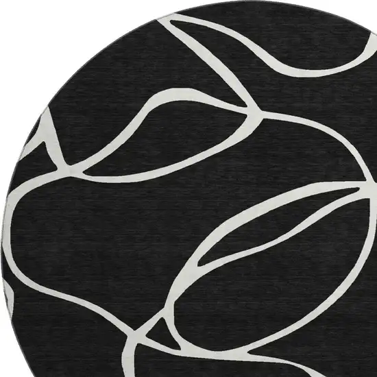 8' Black And Ivory Abstract Washable Round Rug With UV Protection Photo 2