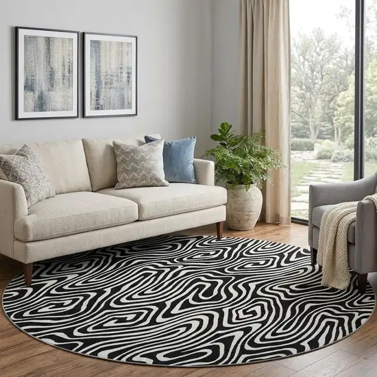 8' Black And Ivory Abstract Washable Round Rug With UV Protection Photo 1