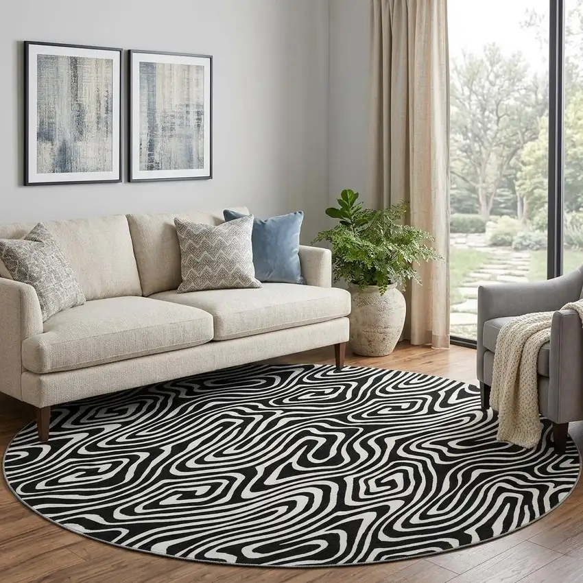 8' Black And Ivory Abstract Washable Round Rug With UV Protection Photo 1