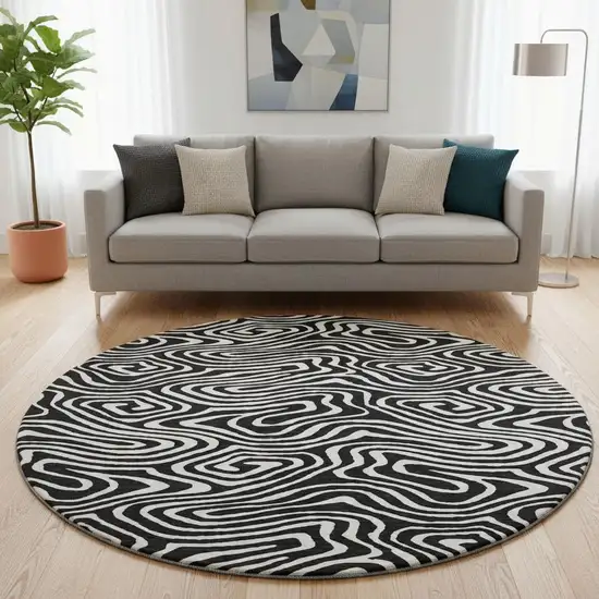 8' Black And Ivory Abstract Washable Round Rug With UV Protection Photo 2