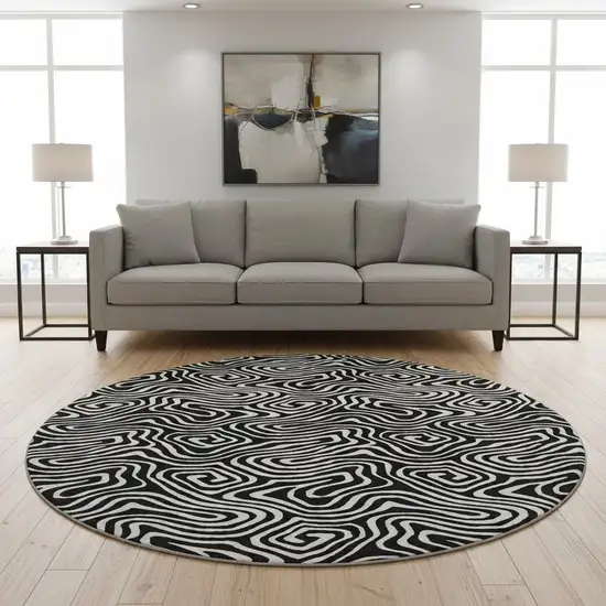 8' Black And Ivory Abstract Washable Round Rug With UV Protection Photo 2