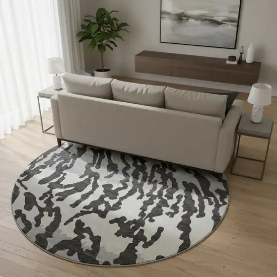 8' Black And Ivory Animal Print Washable Round Rug With UV Protection Photo 2