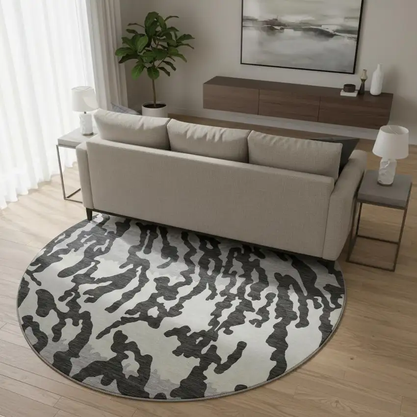 8' Black And Ivory Animal Print Washable Round Rug With UV Protection Photo 2