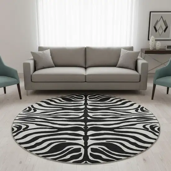 8' Black And Ivory Animal Print Washable Round Rug With UV Protection Photo 2